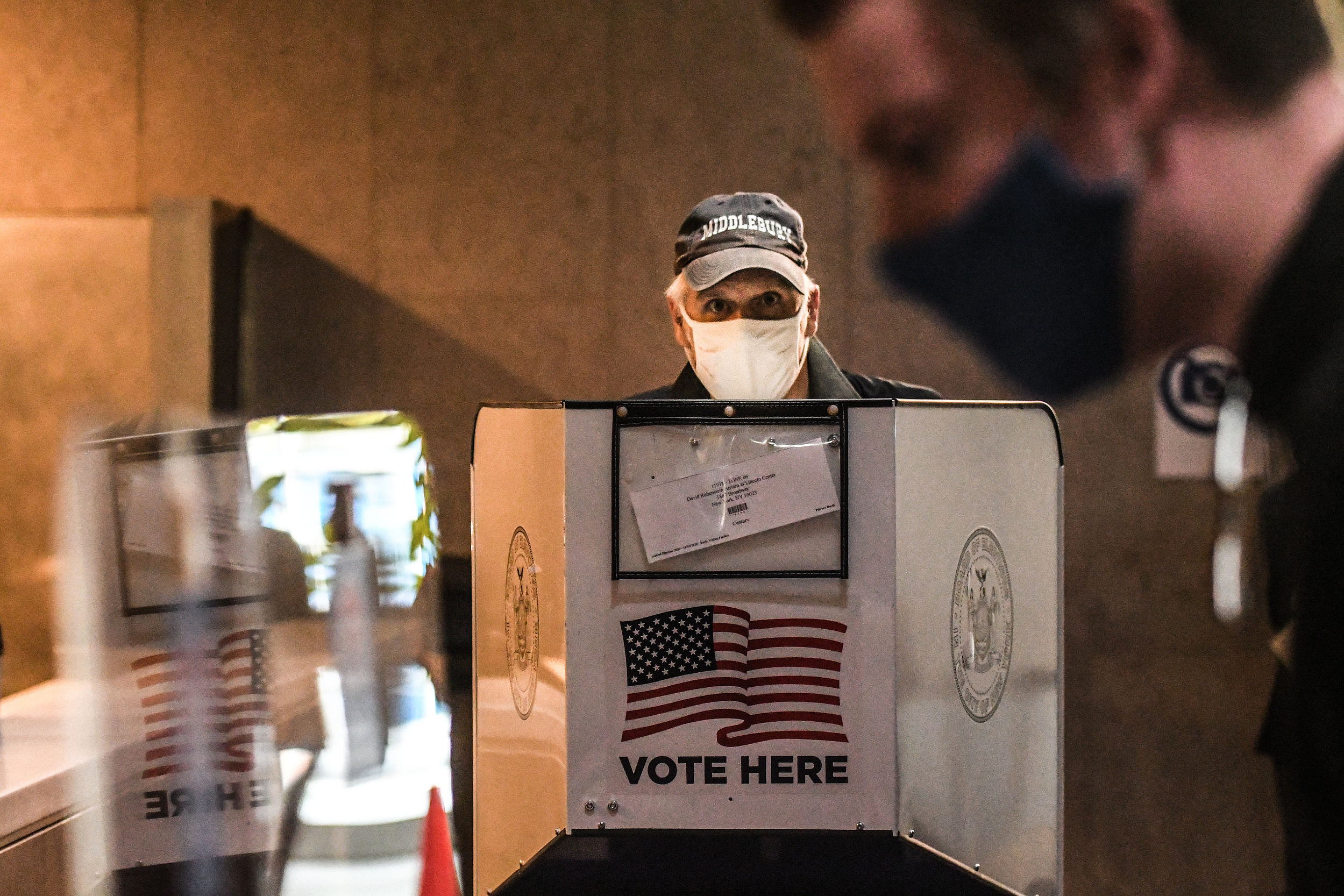 NEW YORK, NY - OCTOBER 24: People vote at Lincoln Center during early voting for the U.S. Presidential election on October 24, 2020 in New York City. Due to the coronavirus and social distancing concerns New York State is allowing early voting for the fir